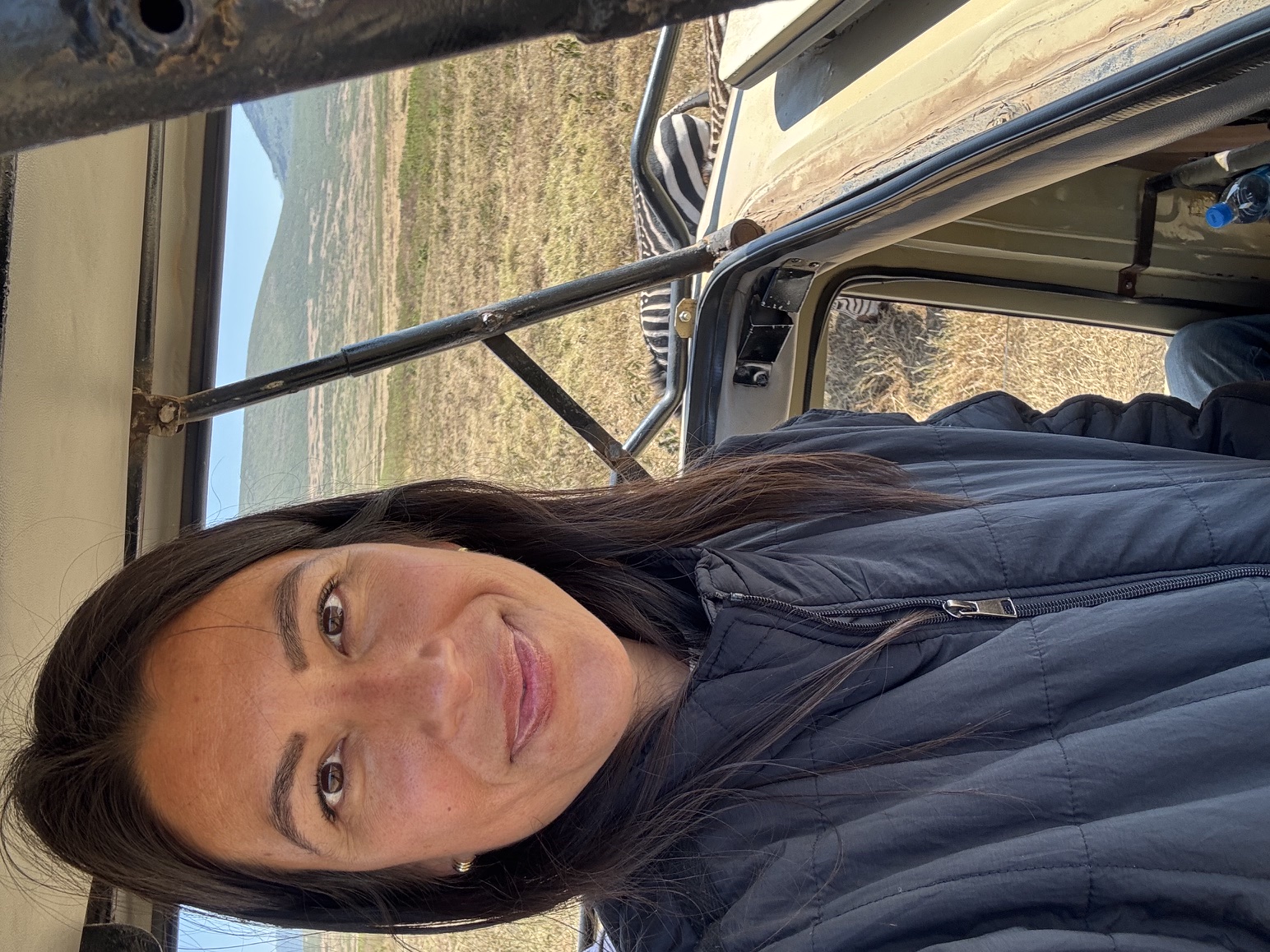 Guest enjoying a close zebra sighting during a Reed Safari game drive